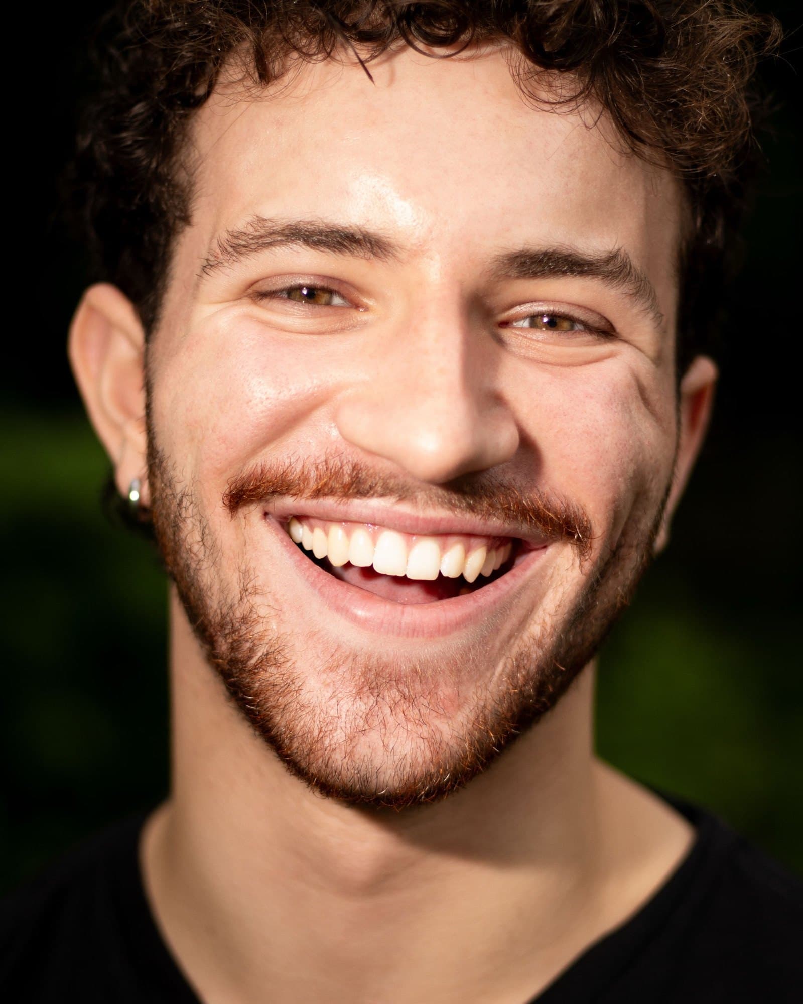 AJ DeAugustine, laughing outdoors