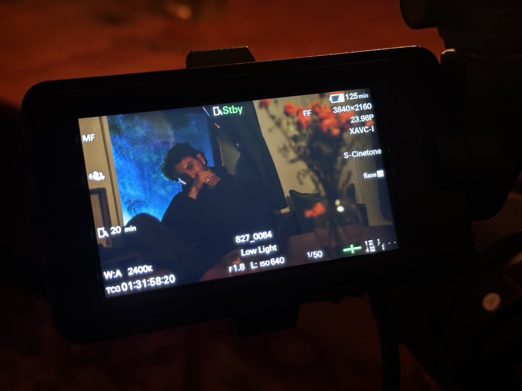 AJ DeAugustine on a camera monitor on set