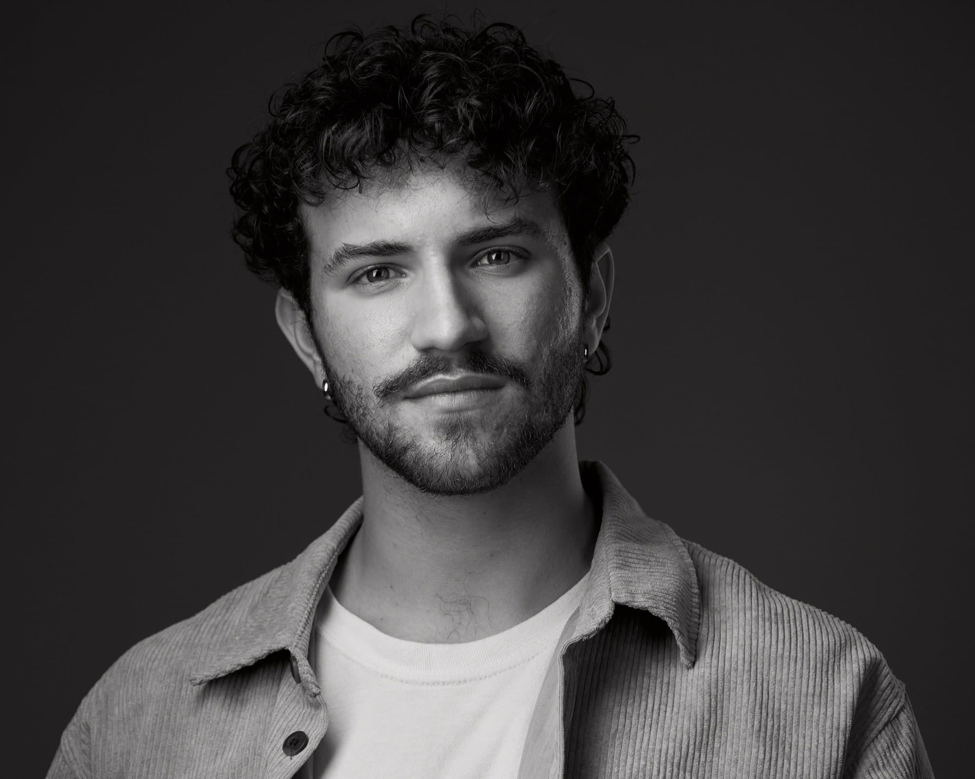 AJ DeAugustine, black and white headshot